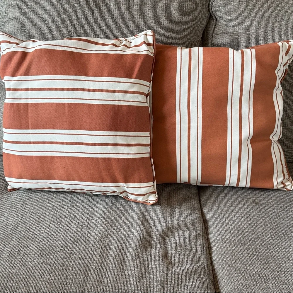 Orange and cream throw pillows